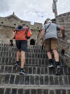 Hiking the steep steps of Mutianyu Great Wall with a 20-year expert Beijing guide.